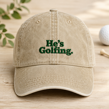 He's Golfing Washed Cap, Funny Embroidered Golf Hat for Dad - Washed Cap - front view