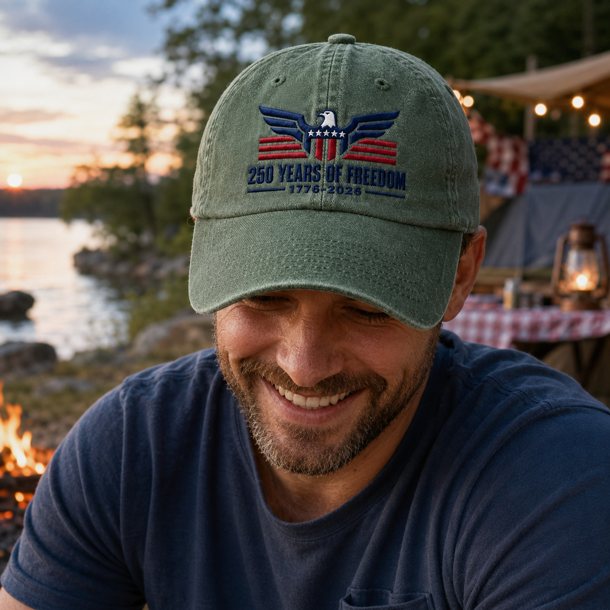Man by a campfire wearing an army green washed baseball cap with an embroidered patriotic eagle design