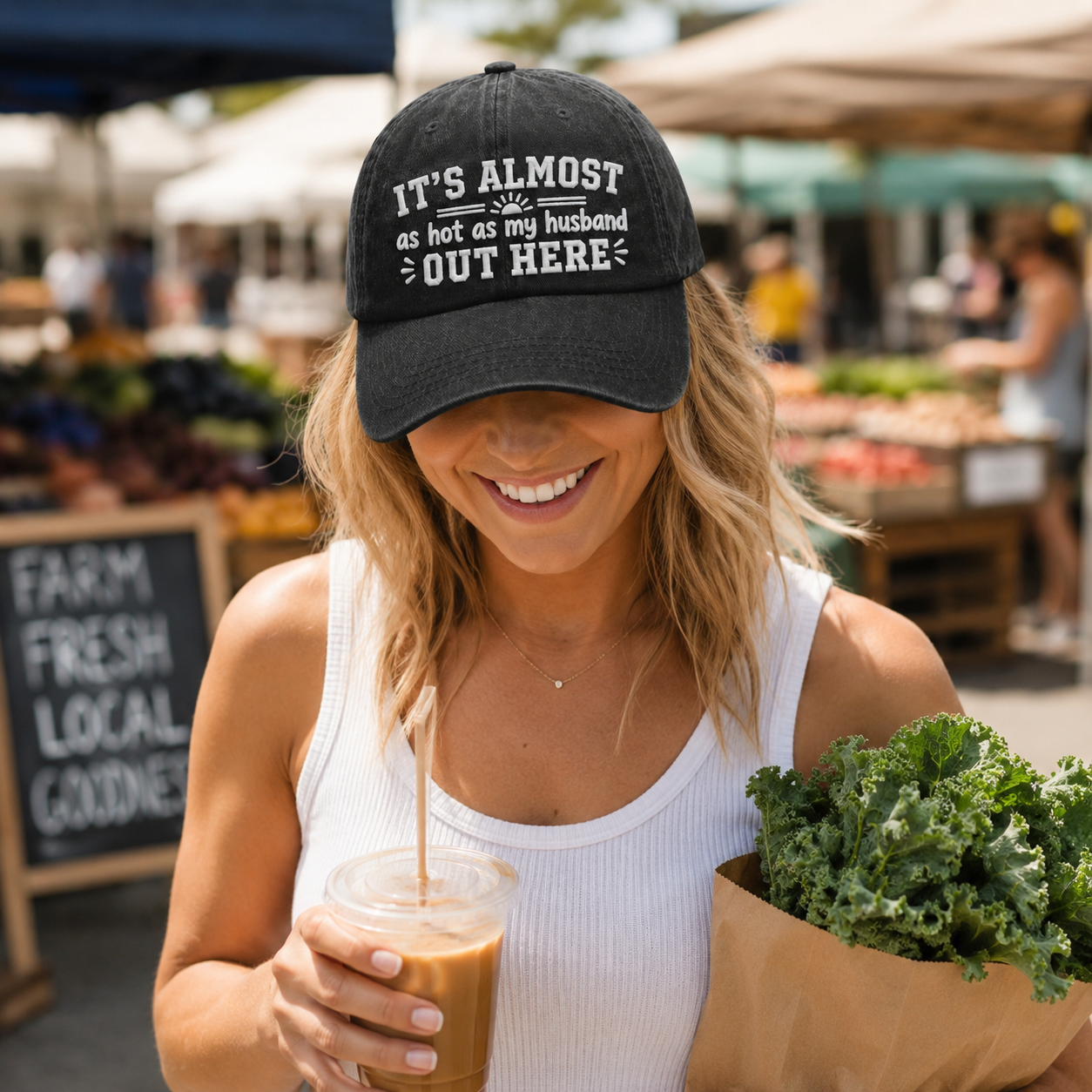 Woman shopping at a market wearing a black washed baseball cap with embroidered funny marriage quote text