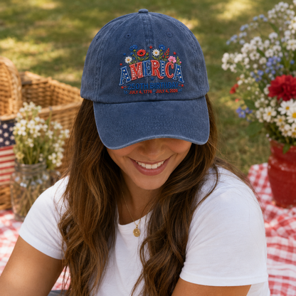 Woman at a 4th of July picnic wearing a navy washed baseball cap with embroidered patriotic floral America artwork