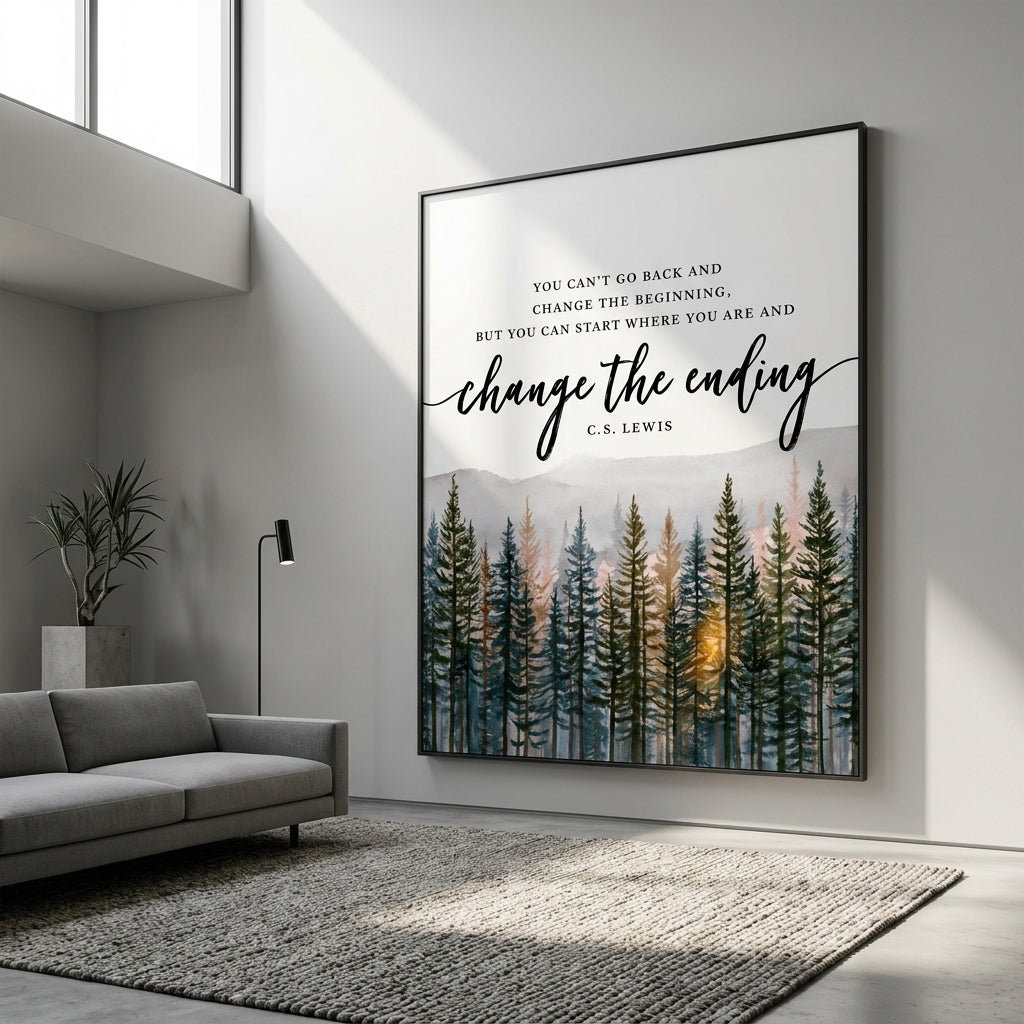 A framed wall art print hanging on a light gray wall in a modern living room. The print features a forest scene with tall dark trees and a warm glowing sun near the horizon, with the quote 'YOU CAN'T GO BACK AND CHANGE THE BEGINNING, BUT YOU CAN START WHERE YOU ARE AND change the ending' and 'C.