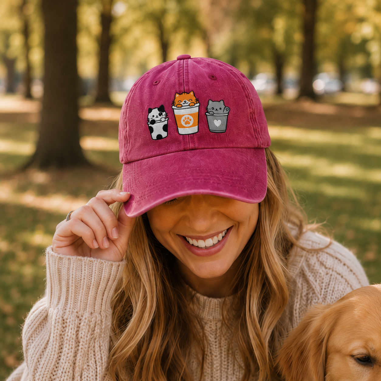 Woman wearing a pink cap with animal icons in a park