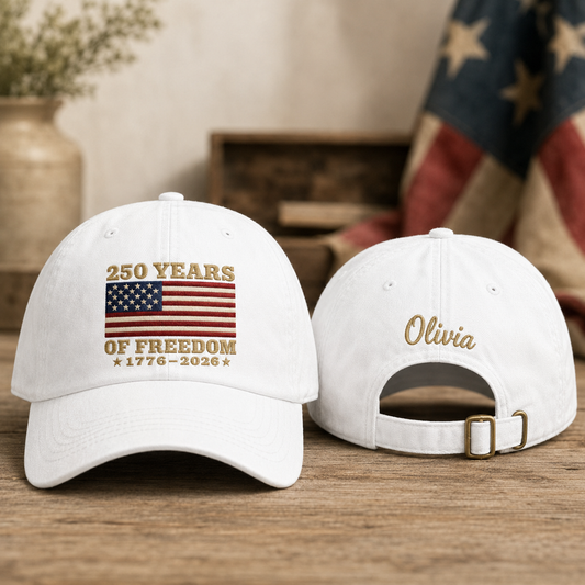 Front and back view of a white washed baseball cap with embroidered US flag design and custom gold name Olivia text