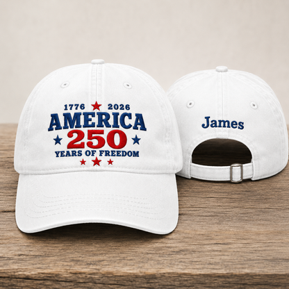 Front and back view of a white washed baseball cap with embroidered blue and red America 250 years of freedom text design and custom name James