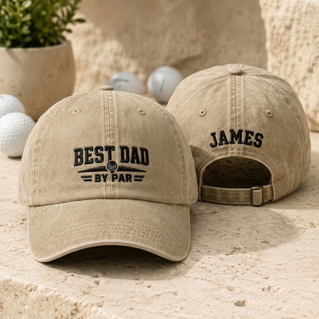 Front and back view of a sand washed baseball cap with black embroidered golf best dad by par design and custom name James
