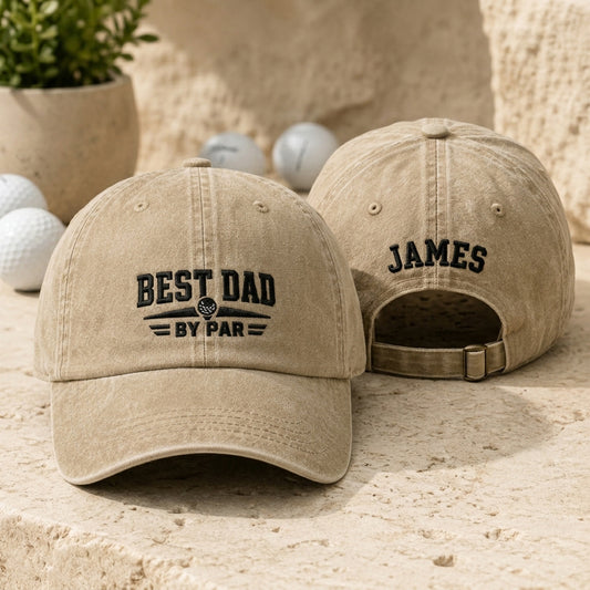 Front and back view of a sand washed baseball cap with black embroidered golf best dad by par design and custom name James