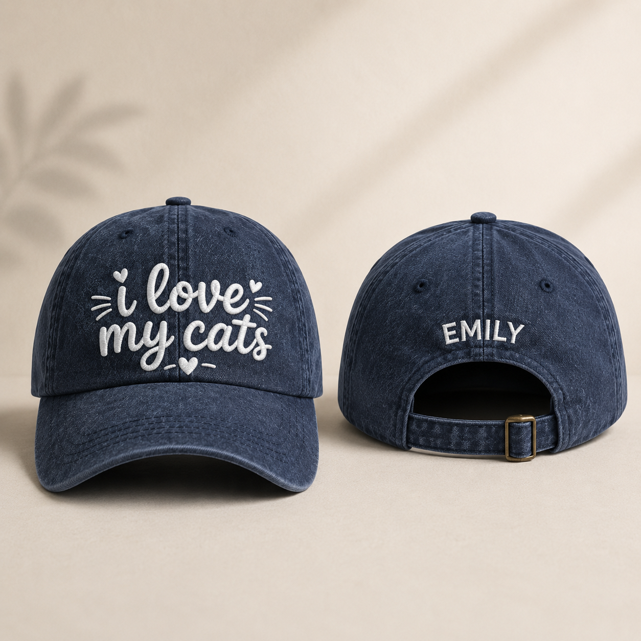 Front and back view of a navy washed baseball cap with I love my cats embroidery and personalized name Emily text