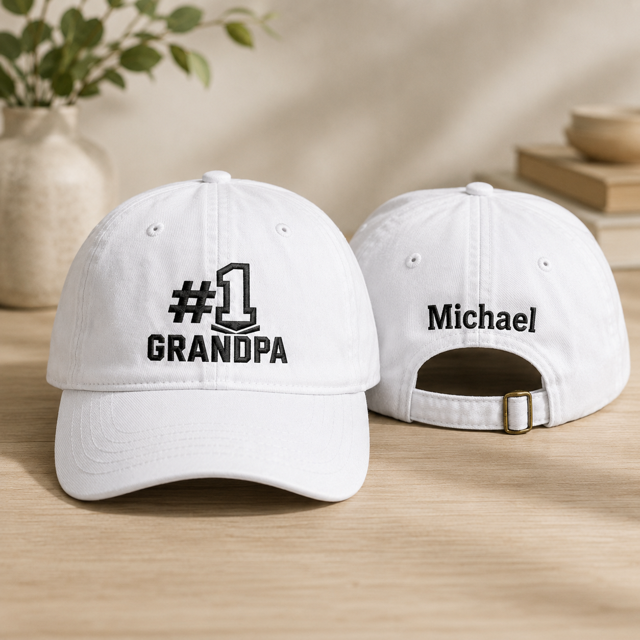 Front and back view of a white washed baseball cap with black embroidered number one grandpa design and custom name Michael