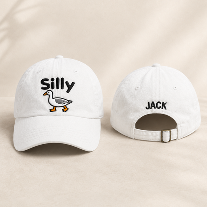 Front and back view of a white washed baseball cap with embroidered silly goose design and custom name Jack text