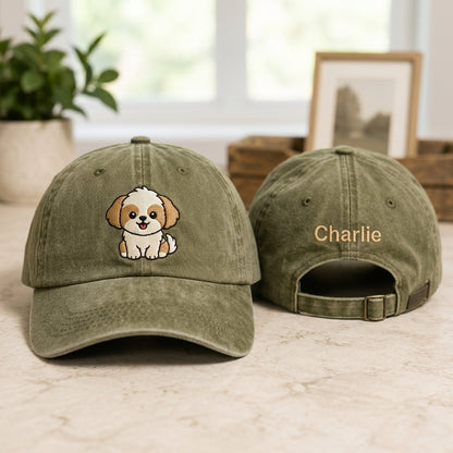 Two green baseball caps with a dog illustration and 'Charlie' text on a light surface.