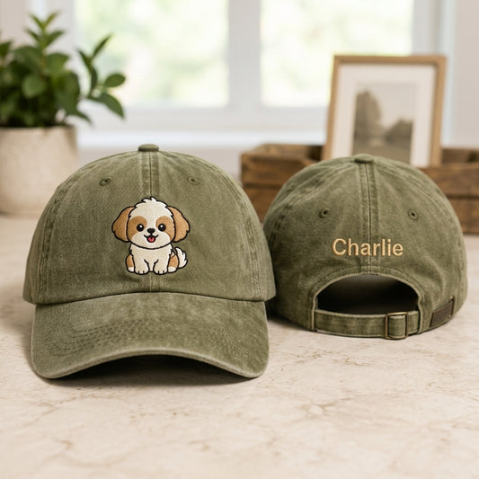 Two green baseball caps with a dog illustration and 'Charlie' text on a light surface.