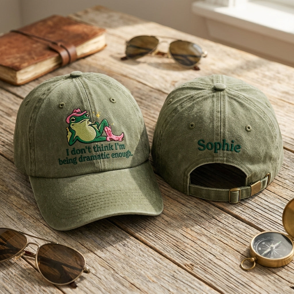 Two green baseball caps on a wooden surface with sunglasses and a compass.