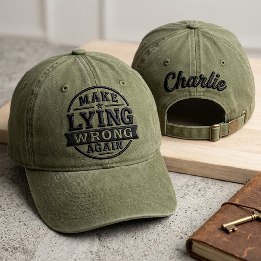 Two green baseball caps with text on a surface.