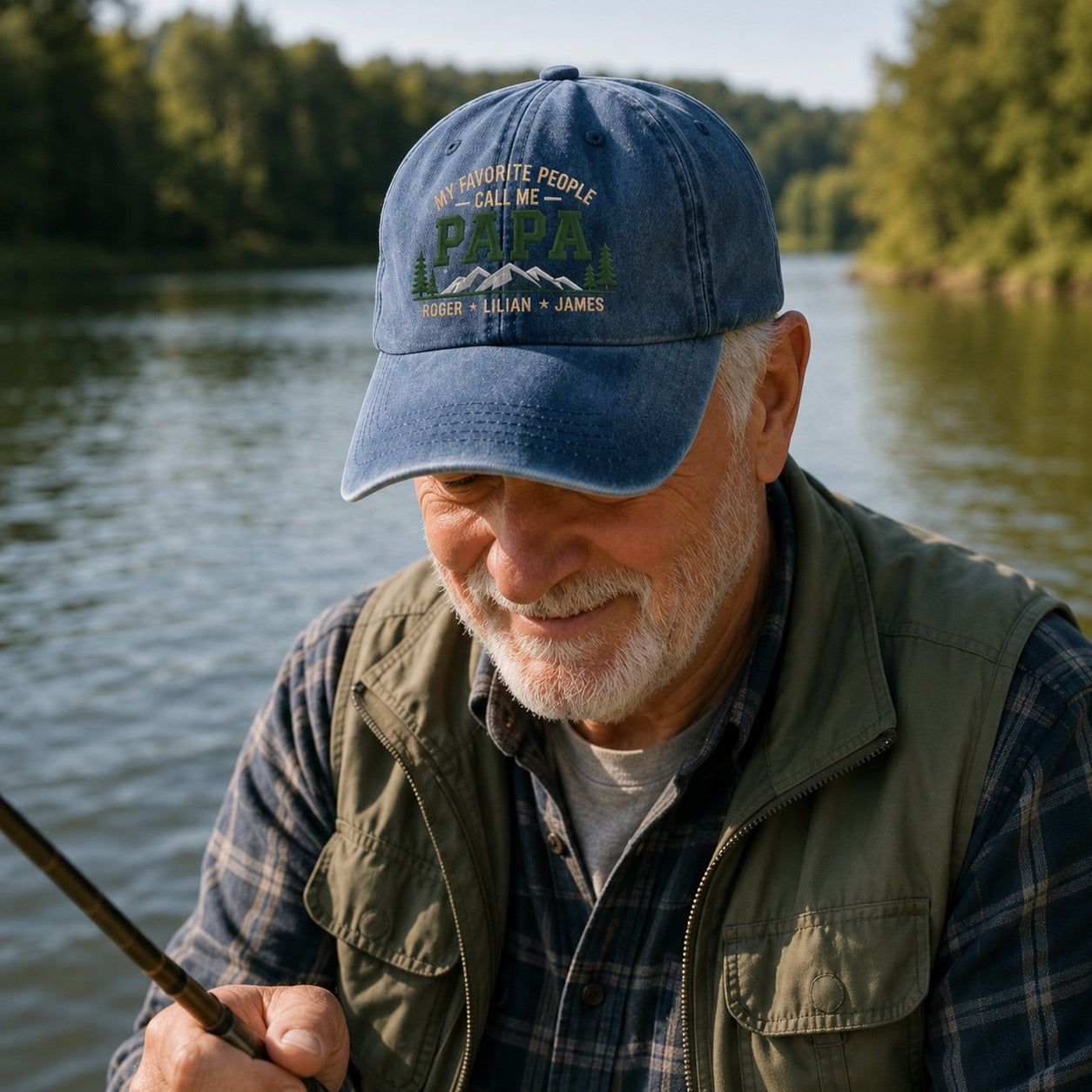Man wearing a blue cap with text by a body of water