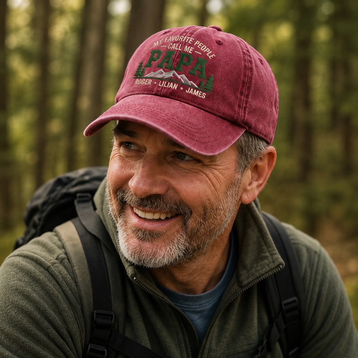 Man wearing a red cap with text in a forest setting
