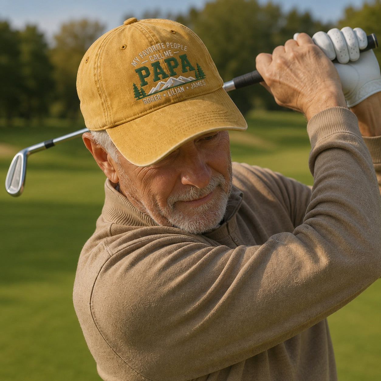 Man swinging a golf club on a golf course wearing a yellow cap with 'PAPA' text.