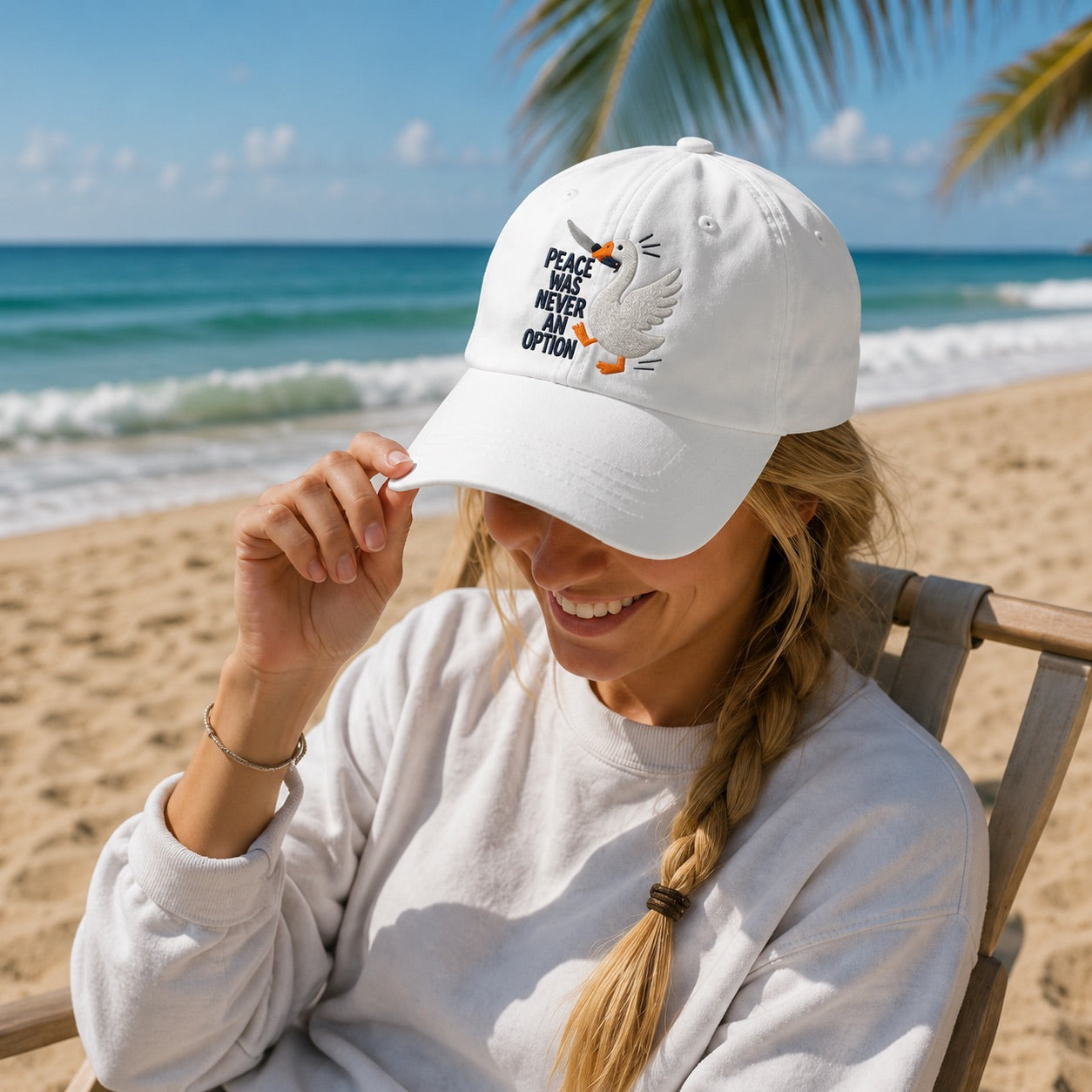 Woman wearing a white cap with a message on a beach