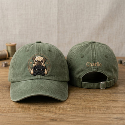 Green baseball cap with dog illustration and 'Charlie' embroidery on a wooden surface.