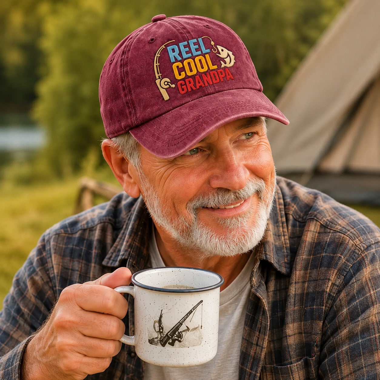 Man wearing a 'Reel Cool Grandpa' cap, holding a mug outdoors with a tent and nature in the background.