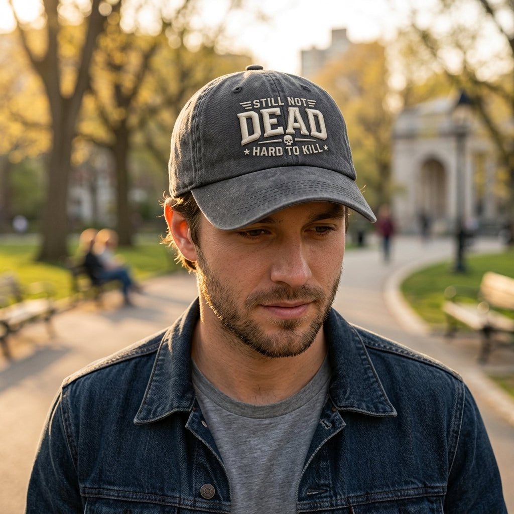 Man wearing a cap with text in an outdoor setting