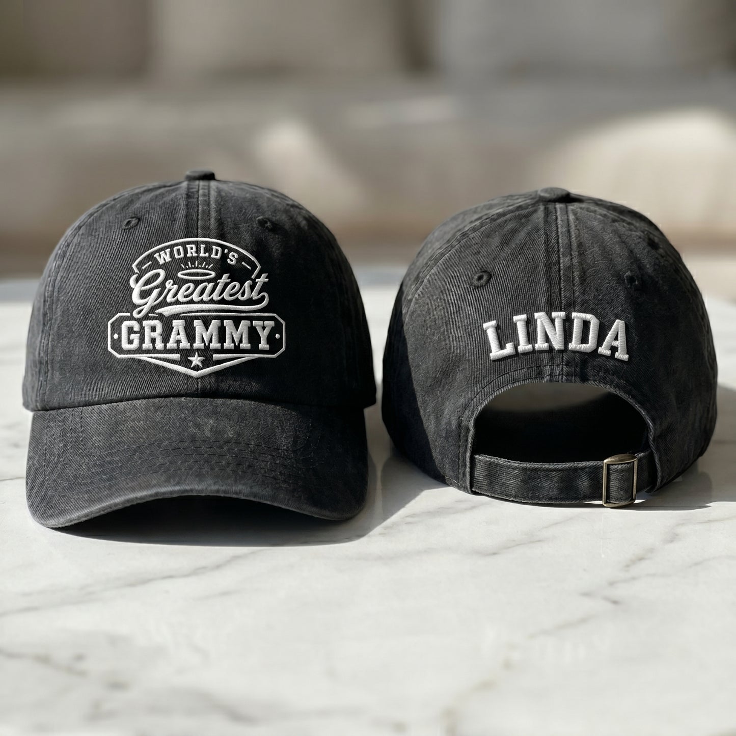Black washed cotton baseball cap with World's Greatest Grammy embroidery and custom name Linda text.