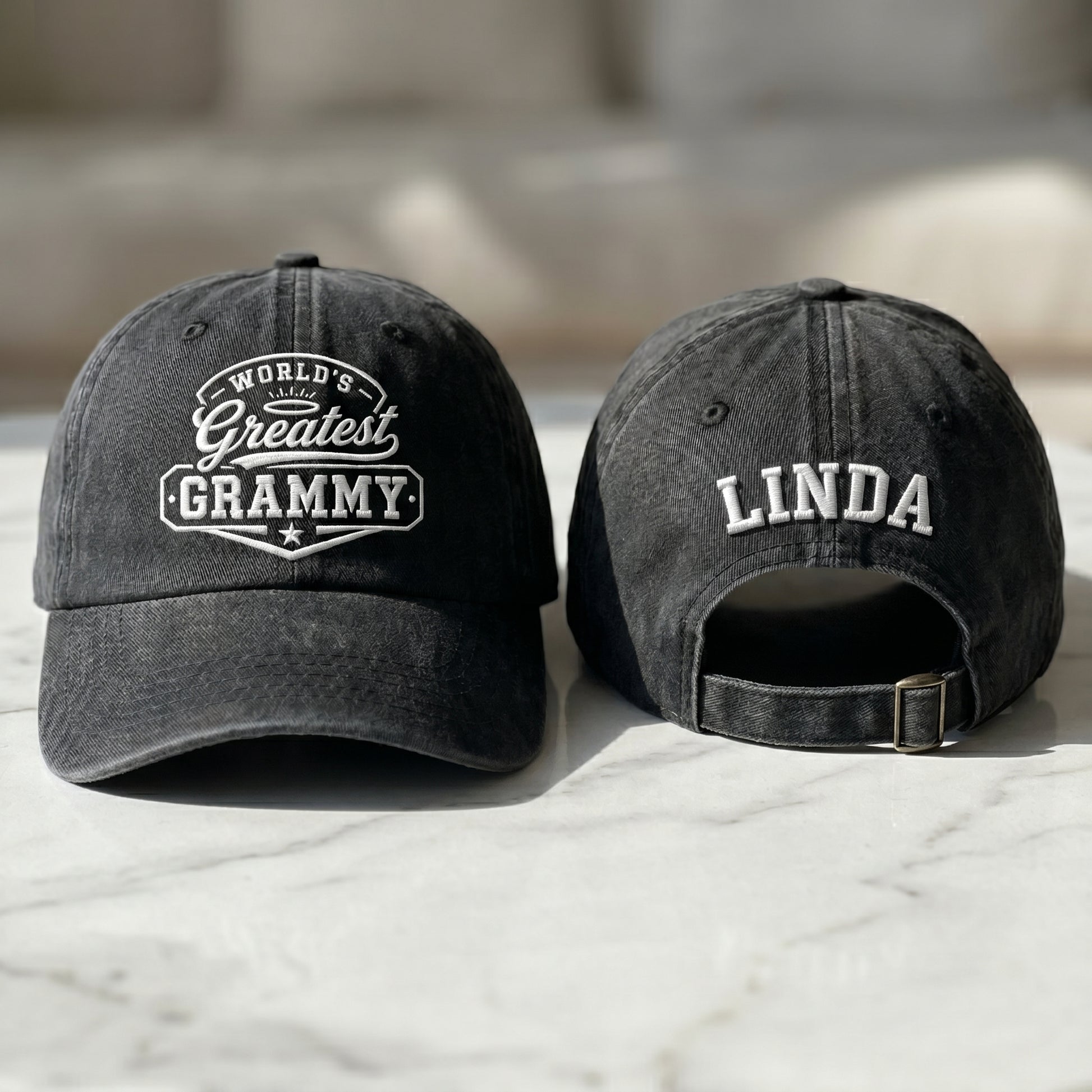 Black washed cotton baseball cap with World's Greatest Grammy embroidery and custom name Linda text.